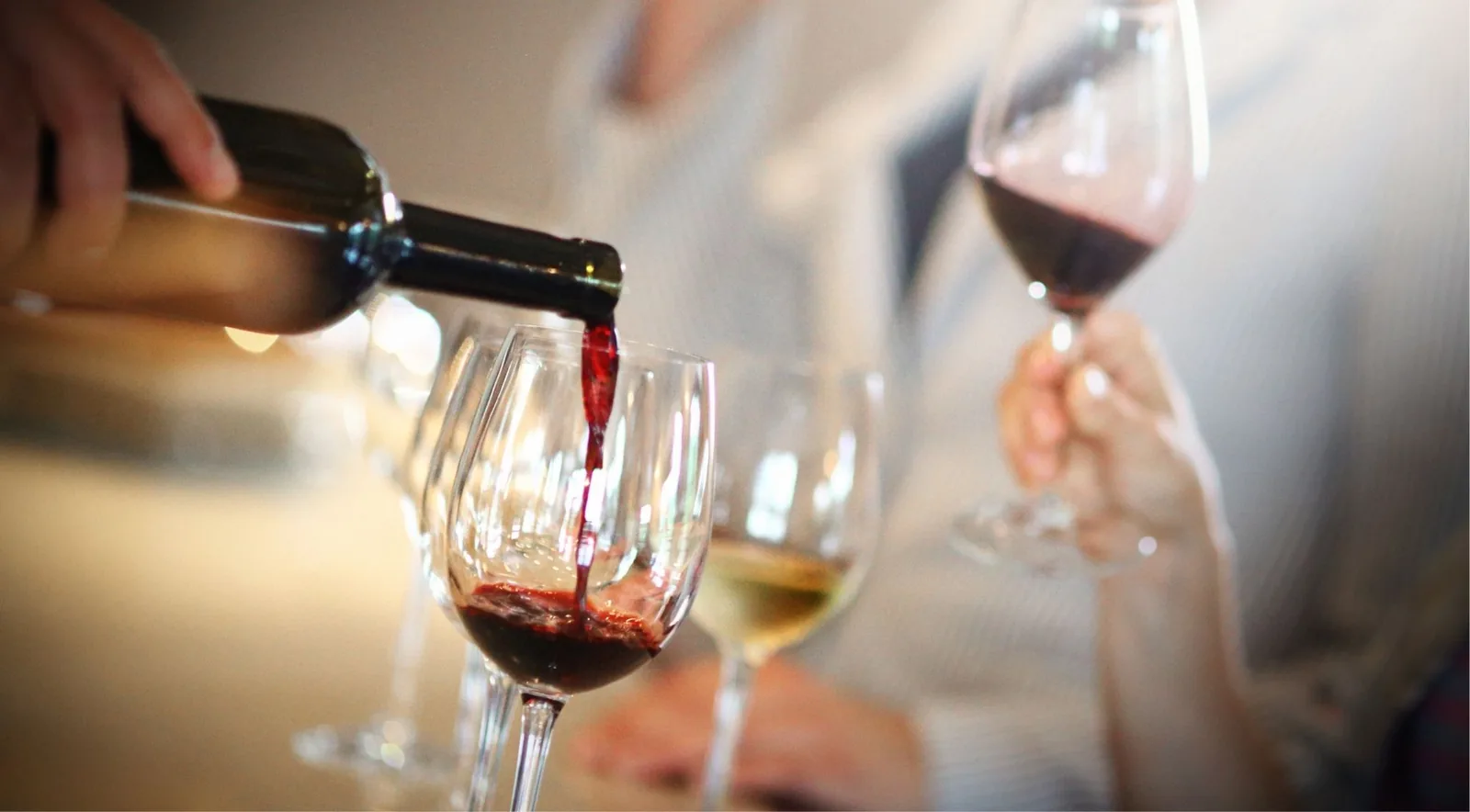 Red wine being poured into glasses during a Douro Valley tasting