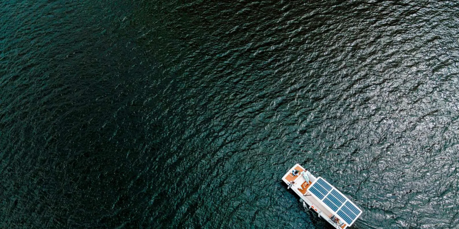 Solar-powered boat gliding along the Douro River near Pinhão